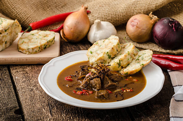 Classic Czech goulash with dumplings Classic Czech goulash with dumplings, delicious heavy food, homemade Karlovarsky dumplings czech republic stock pictures, royalty-free photos & images