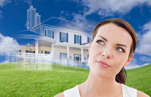 istock Mixed Race Female Looks Over to Ghosted House Drawing Behind 482723852