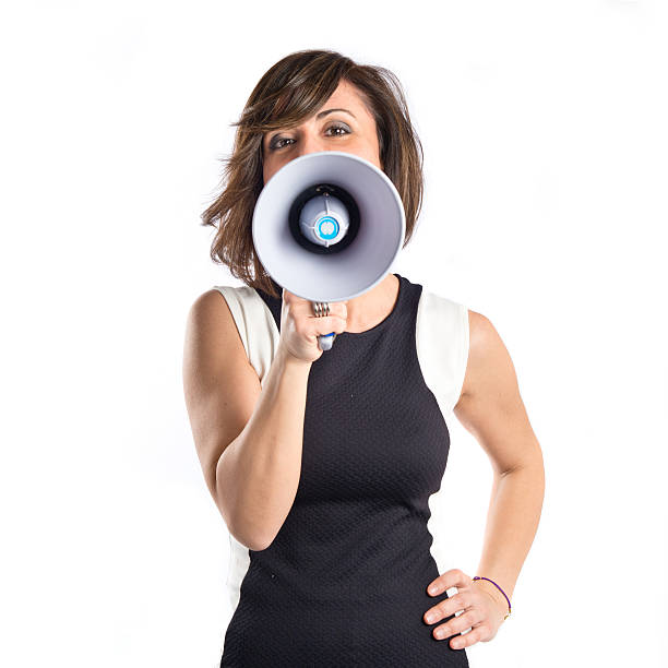istock Pretty girl shouting with a megaphone over white background 482725215
