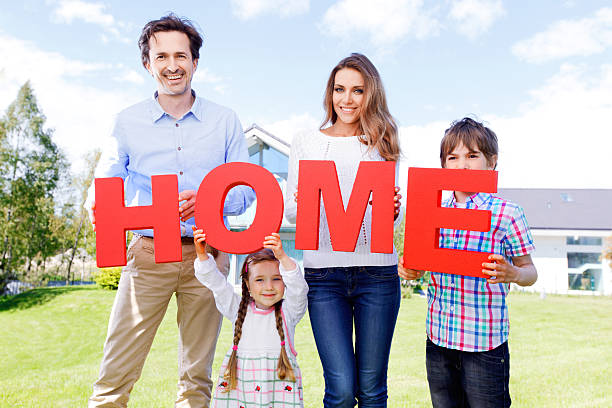 istock family holding home letters 482725332