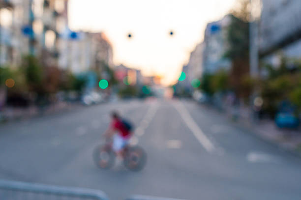 istock Abstract blurred image of man on bicycle in the city 482725656