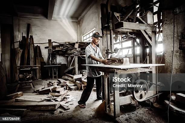 Manual Worker In Carpenter Workshop Vietnam Stock Photo - Download Image Now - Carpenter, Vietnam, Men