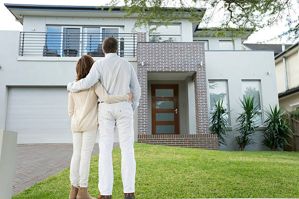 istock Mature couple looking at a house 482727093
