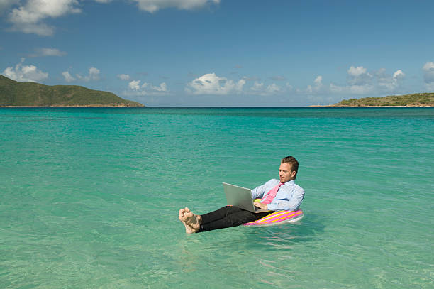 istock Relaxed Floating Businessman Working Adrift with Laptop 482727127