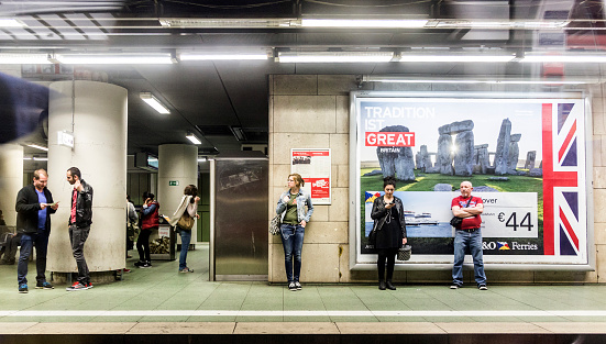 Frankfurt, Germany - March 29, 2014: people wait in the subway station for the train in Frankfurt, Germany. The trains are operated by MTV, founded to cover region Main Taunus in 1987.