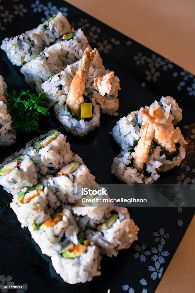 Sushi Variety of sushi on a platter on a table Contrasts Stock Photo