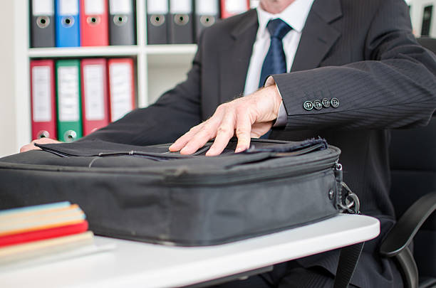 istock Businessman opening his laptop suitcase 482728664