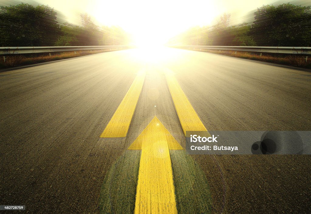 Road and Yellow arrow. Road With Painted Yellow arrow Line. The Way Forward Stock Photo