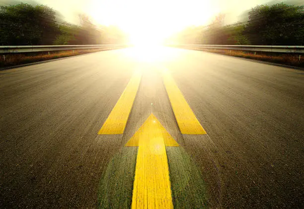 Road With Painted Yellow arrow Line.