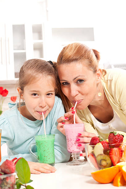 istock Happy young family drinking fresh  juice 482729127
