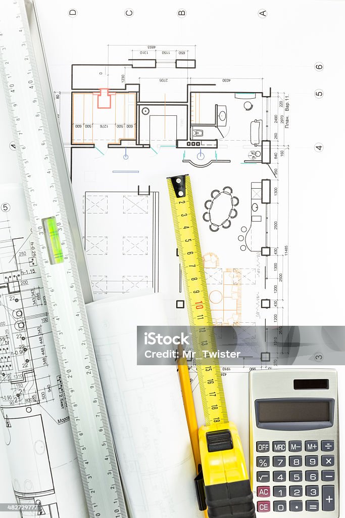 Architectural drawing detail and several measurement tools Construction building plans with calculator, pencil, spirit level and tape measure Angle Stock Photo