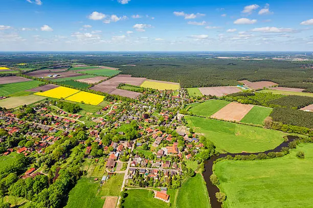Aerial view of a suburban area and agricultural land in Germany.Small village is suburb from Celle, in Lower Saxony, Germany.