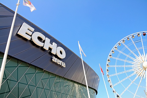 Liverpool, United Kingdom - June 11, 2015: Echo Arena and Convention Centre with the Liverpool Wheel to the right at Kings Dock, Liverpool, Merseyside, England, UK, Western Europe.