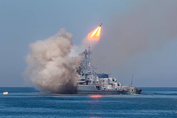 missile frigate of Russian fleet A missile frigate of the Russian Navy makes missile launch during Marine Parade on the Navy day near Sevastopol  battleship photos stock pictures, royalty-free photos & images