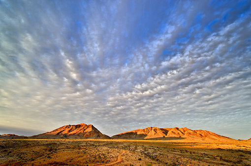 Copyspace above a wide angle landscape of the Northern Cape mountains on the border between South Africa and Namibia