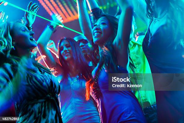 Party People Dancing In Disco Or Club Stock Photo - Download Image Now - Dancing, Night, Party - Social Event