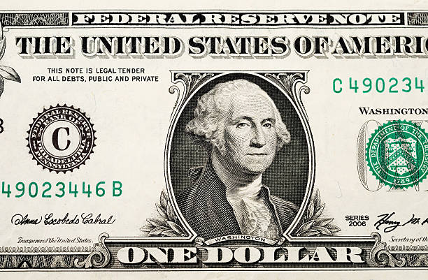 USA currency one dollar bill Partial view of a USA one dollar bill showing portrait of George Washington and phrase: "This note is legal tender for all debts, public and private". american one dollar bill photos stock pictures, royalty-free photos & images