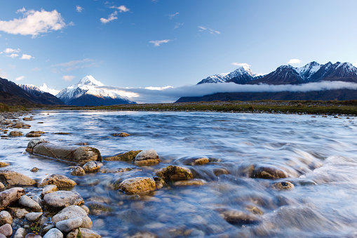 A beautiful stream running through New Zealand's Tasman Valley. Mt Cook can be seen to the left.
