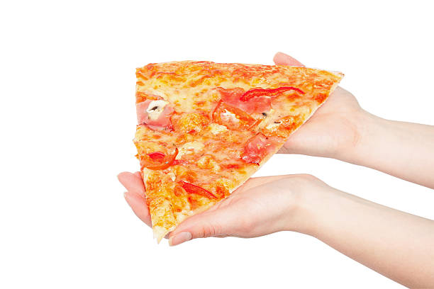 istock piece of a pizza in giving hands 482745809