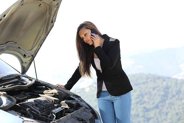 istock Woman on the phone looking her crash breakdown car 482745829