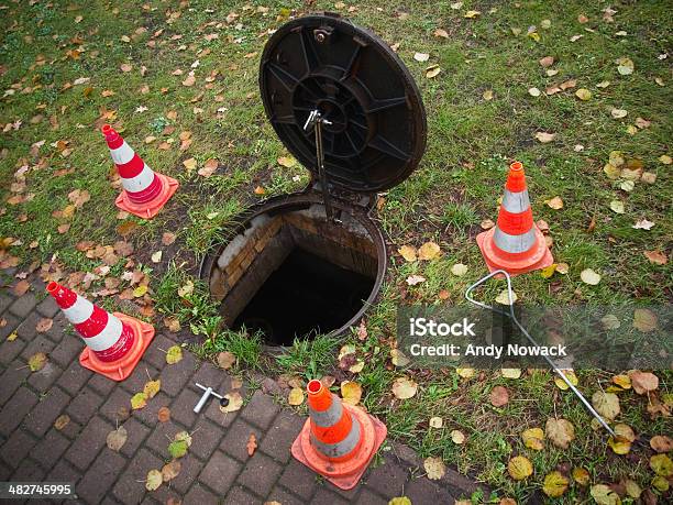 Open Manhole On The Lawn Stock Photo - Download Image Now - Sewer, Service, Manhole