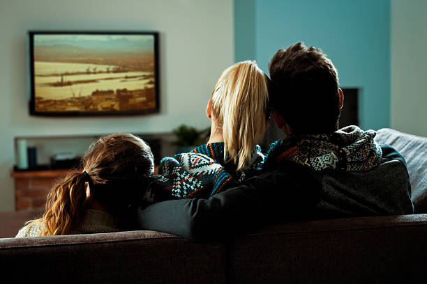 istock Family watching TV 482746253