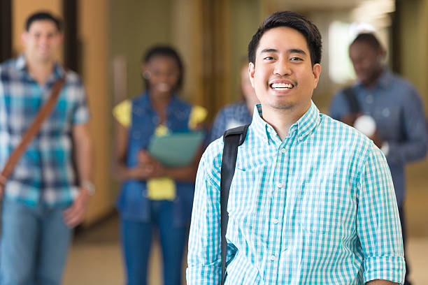 istock Young man in front of fellow students on campus 482746281