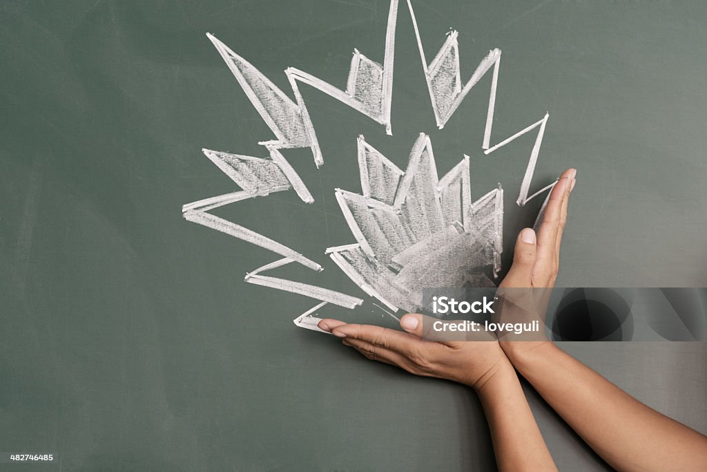 burst from hand burst written on blackboard Art Stock Photo