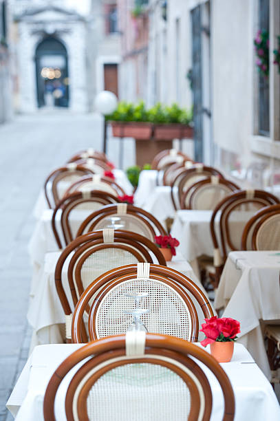 istock Empty restaurant tables in a historic European town 482747083
