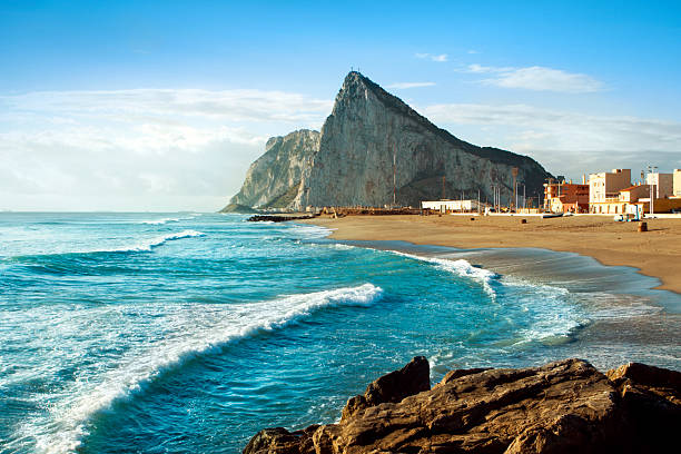 Gibraltar and the Sea The famous "Rock" of Gibraltar as seen from the Mediterranean coast of Southern Spain. andalusia stock pictures, royalty-free photos & images