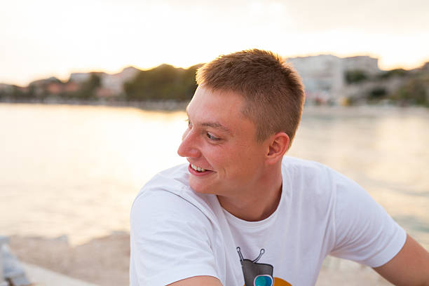 istock Man spending time on seashore in colorfull shirt. 482747630