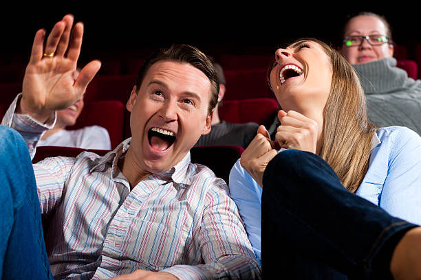 Couple and other people in cinema stock photo