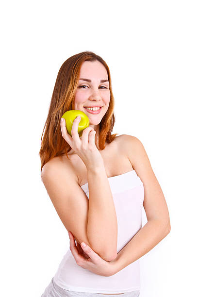 istock Attractive young woman with an apple 482748213