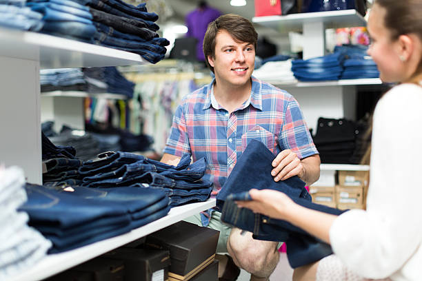 istock Couple choosing denim in store 482748306