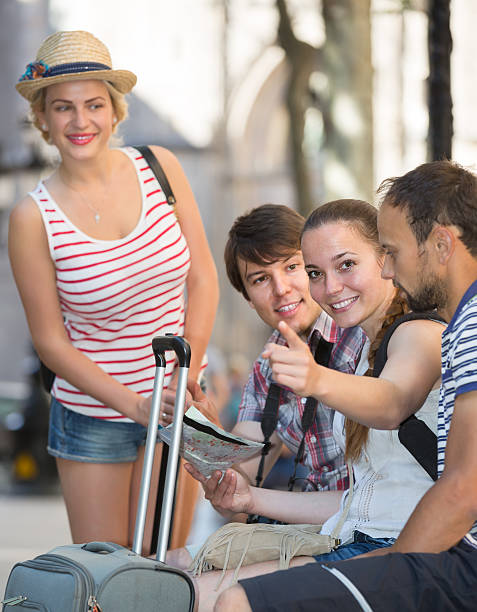 istock tourists with map exploring the city destination 482748404