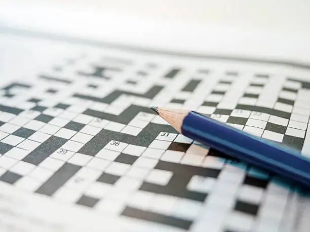 Crossword puzzle game and Pencil Blurred Background