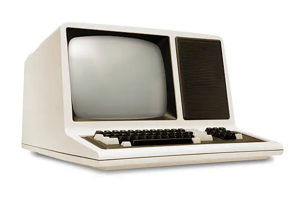 Photo of Vintage old computer, rounded monitor, keyboard, eighties revival, white background