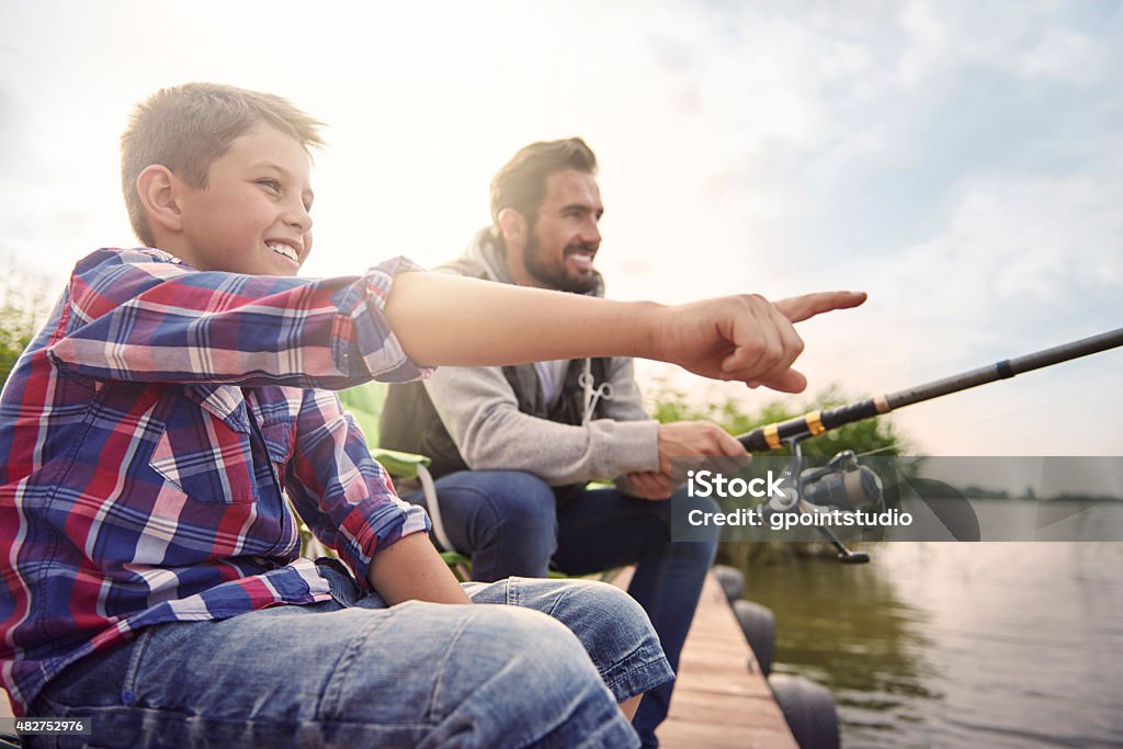 Daddy look! There is a big fish! Fishing Stock Photo