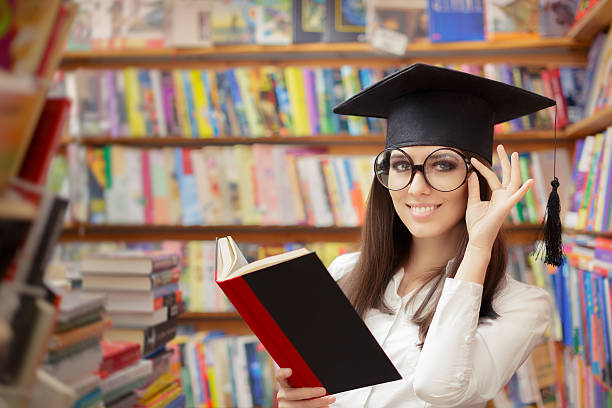 istock Female School Student Reading a Book in a Library 482756868