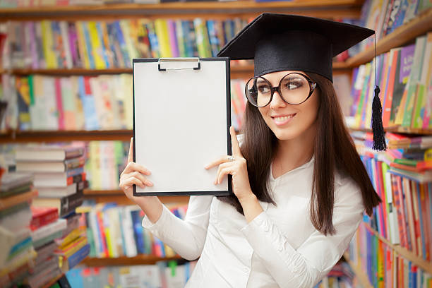 istock Happy School Student Holding Blank Clipboard 482756892