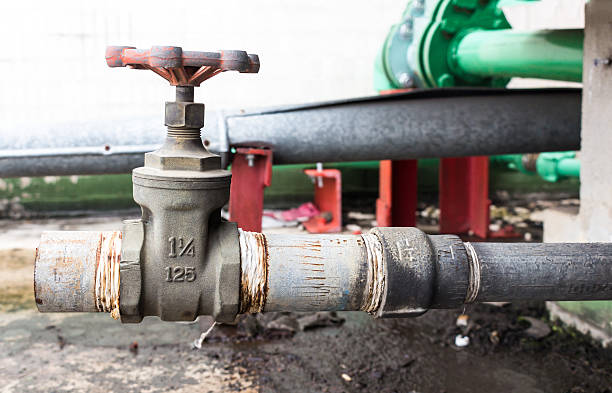 istock Old valve mounted on rooftop industry building 482760126