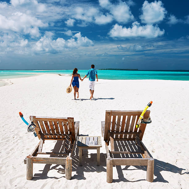 istock Couple running on a beach at Maldives 482761419