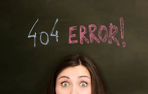 "404 Error" concept on a blackboard, with young woman.