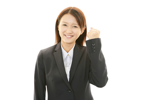 The female office worker who poses happily