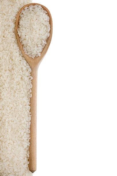 istock Rice in a wooden spoon 482762467
