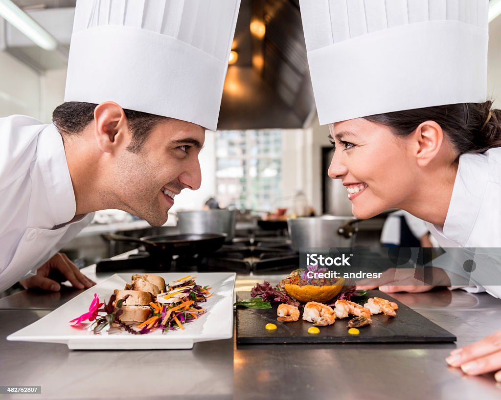 Healthy competition Healthy competition of two chefs in a restaurant Chef Stock Photo