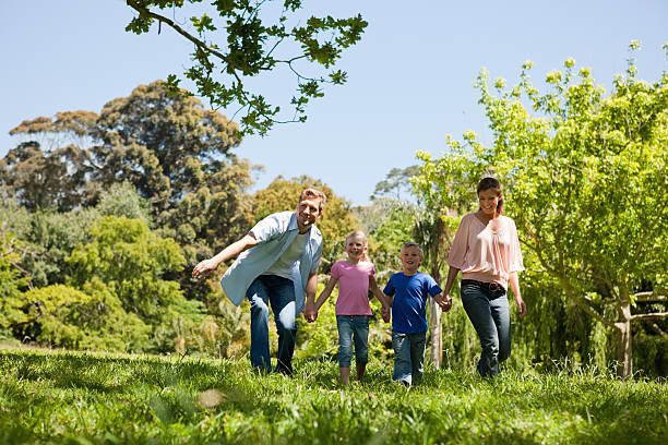 istock Smiling family walking in the countryside 482763103