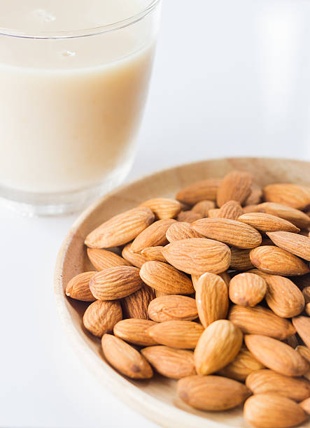istock Almond milk and grain on white kitchen table 482763206