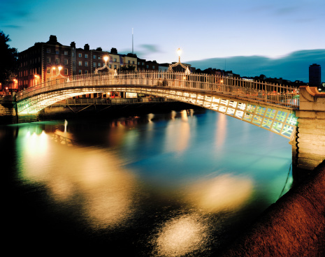 Twilight view of the historical Ha'penny bridge in Dublin, Ireland.