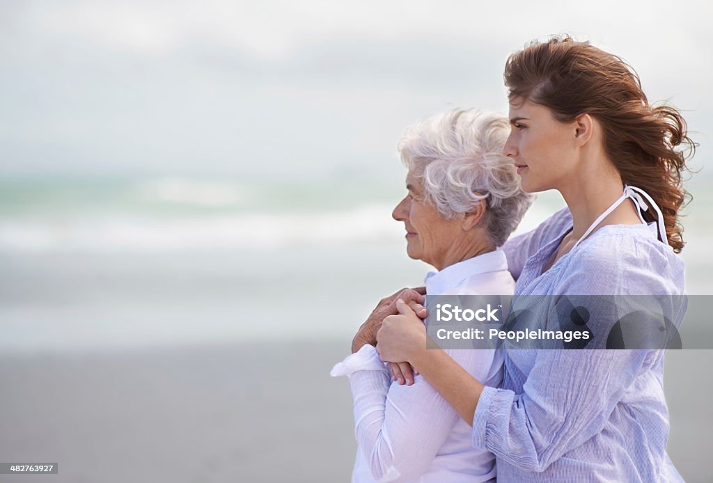 Looking back on their love-filled years together Shot of a beautiful young woman and her senior mother on the beachhttp://195.154.178.81/DATA/shoots/ic_783222.jpg Mother Stock Photo